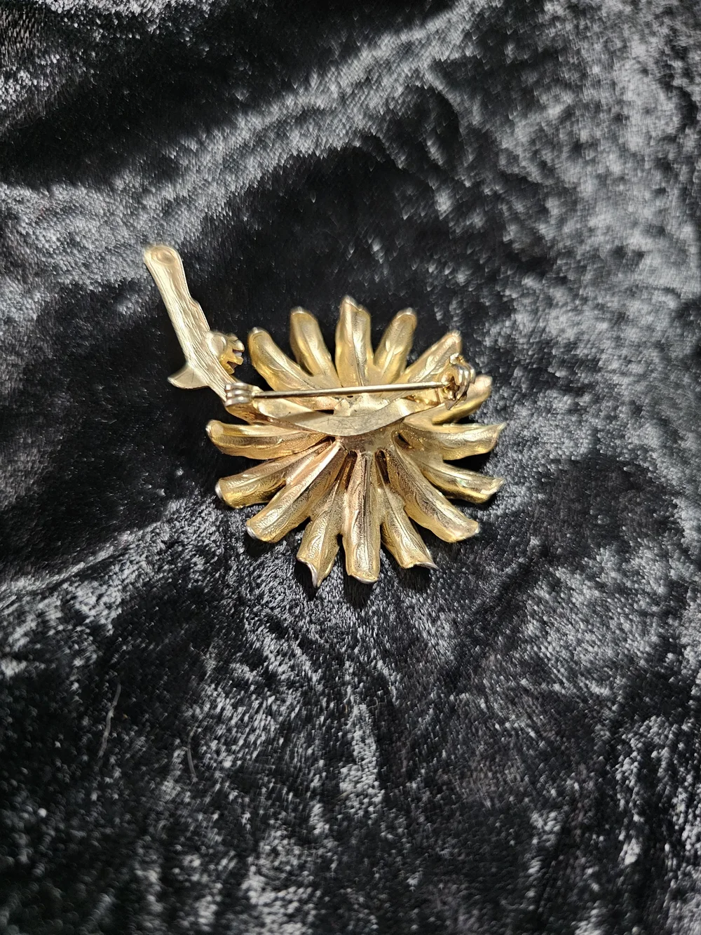 Gold Floral Brooch with Purple Gem Accent